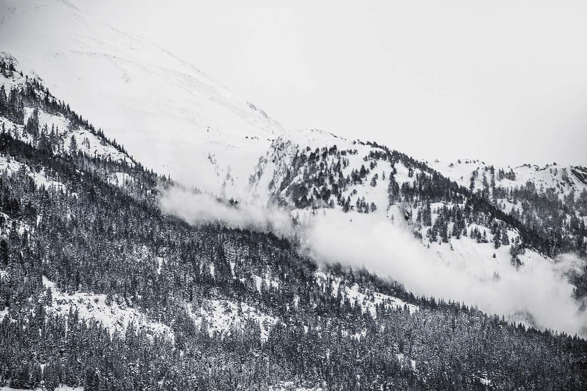 mountain grayscale photography of snowy mountain clouds