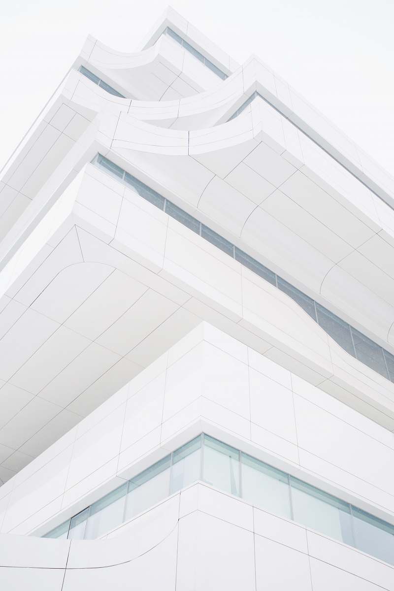grey low angle photography of building dominion tower