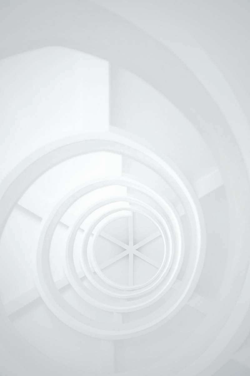 black-and-white low angle photography of stairs spiral