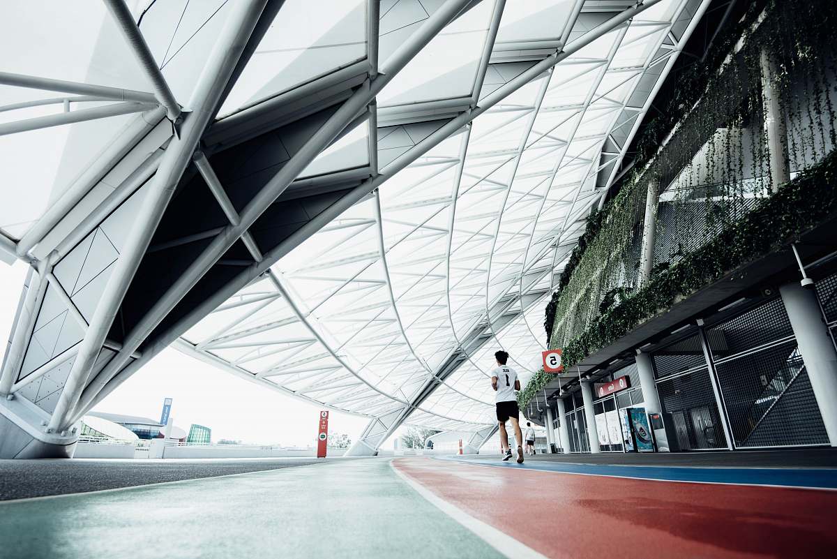 architecture person running on field during daytime airport terminal