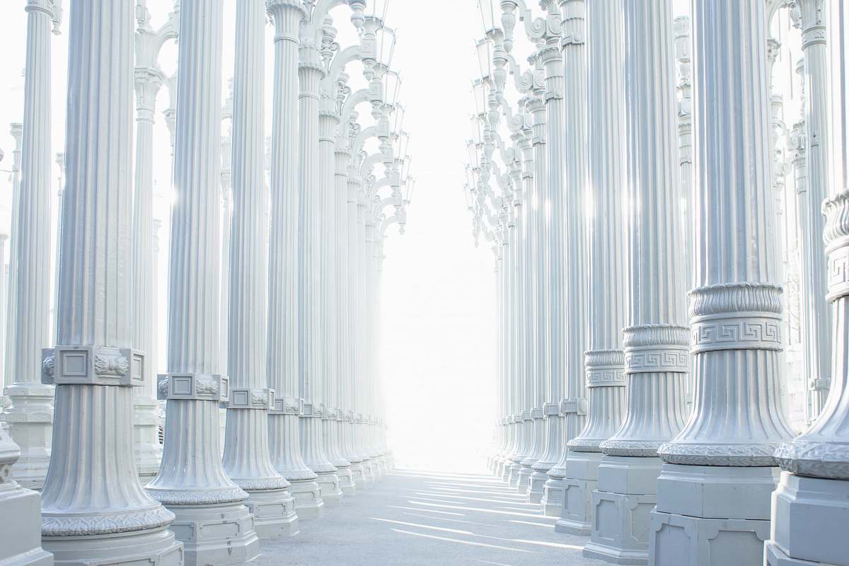architecture photography of white wall lot column