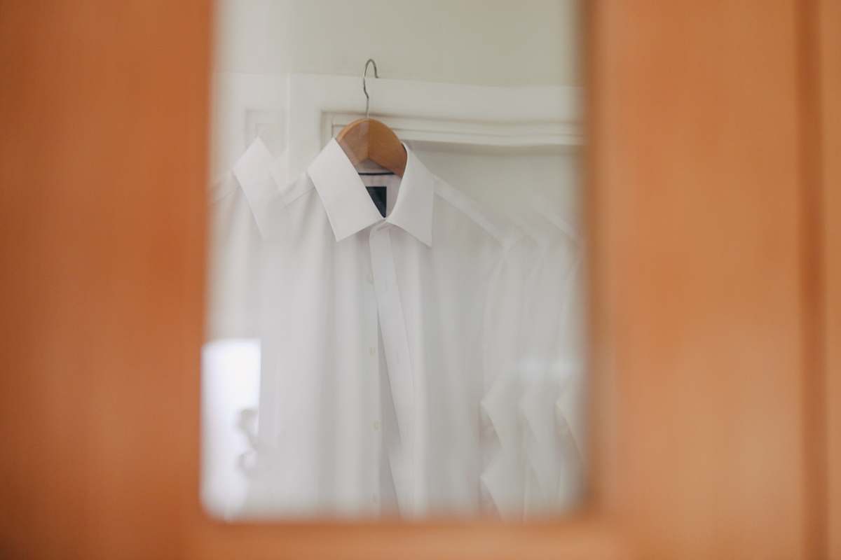 shirt selective focus photography of white dress shirt orange