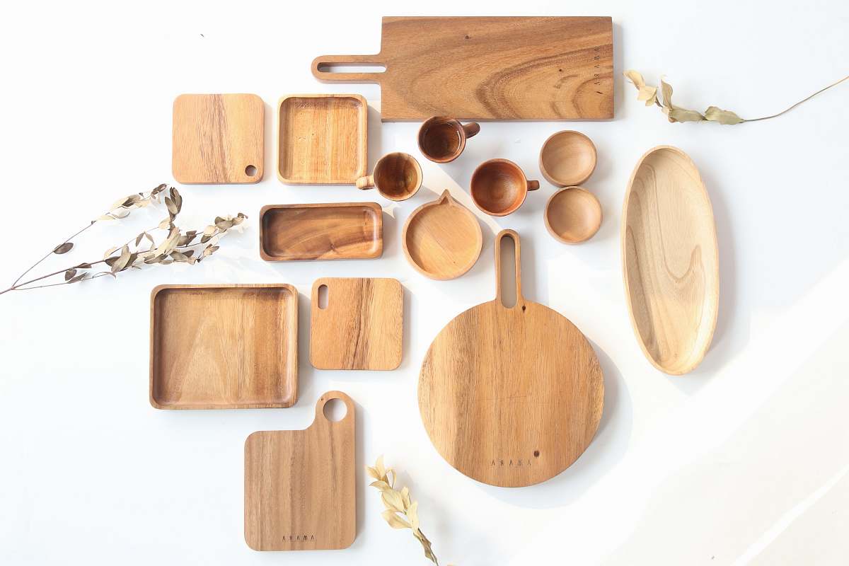 plywood top view of assorted shape and sized wooden kitchen utensils wood