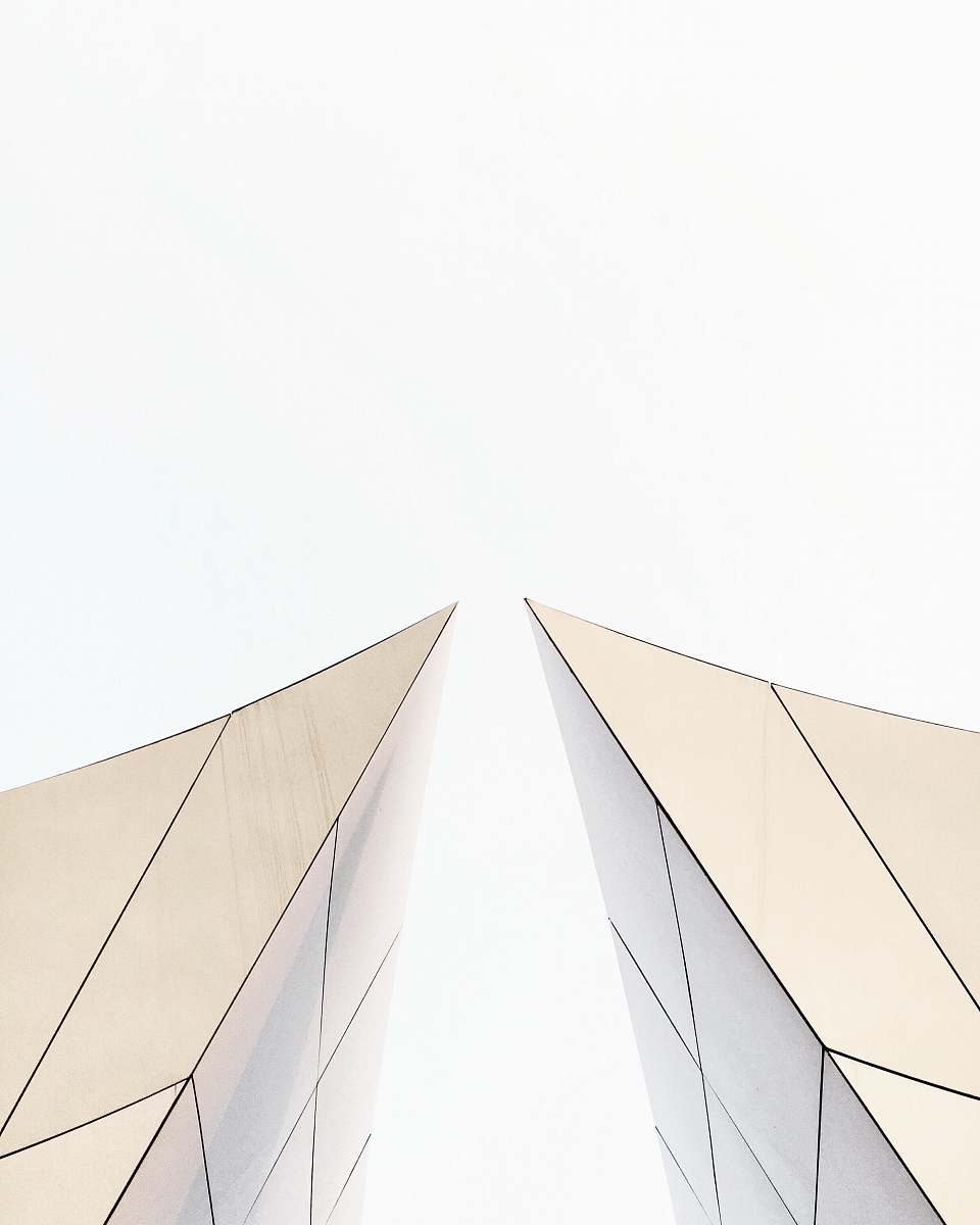 building two white buildings about to touch each other's peak architecture