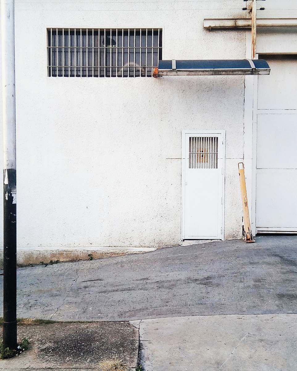venezuela white metal closed door near road at daytime naguanagua