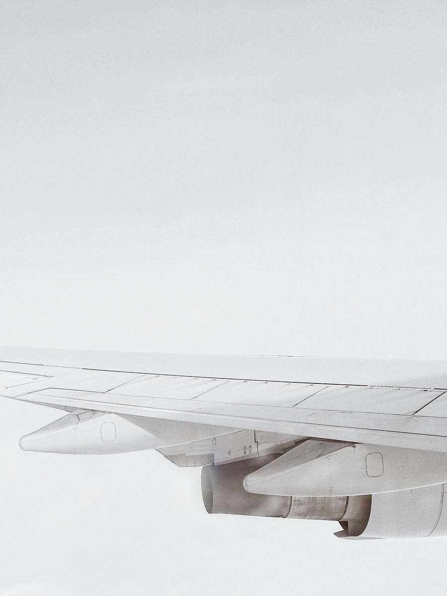 grey white plane wing travel
