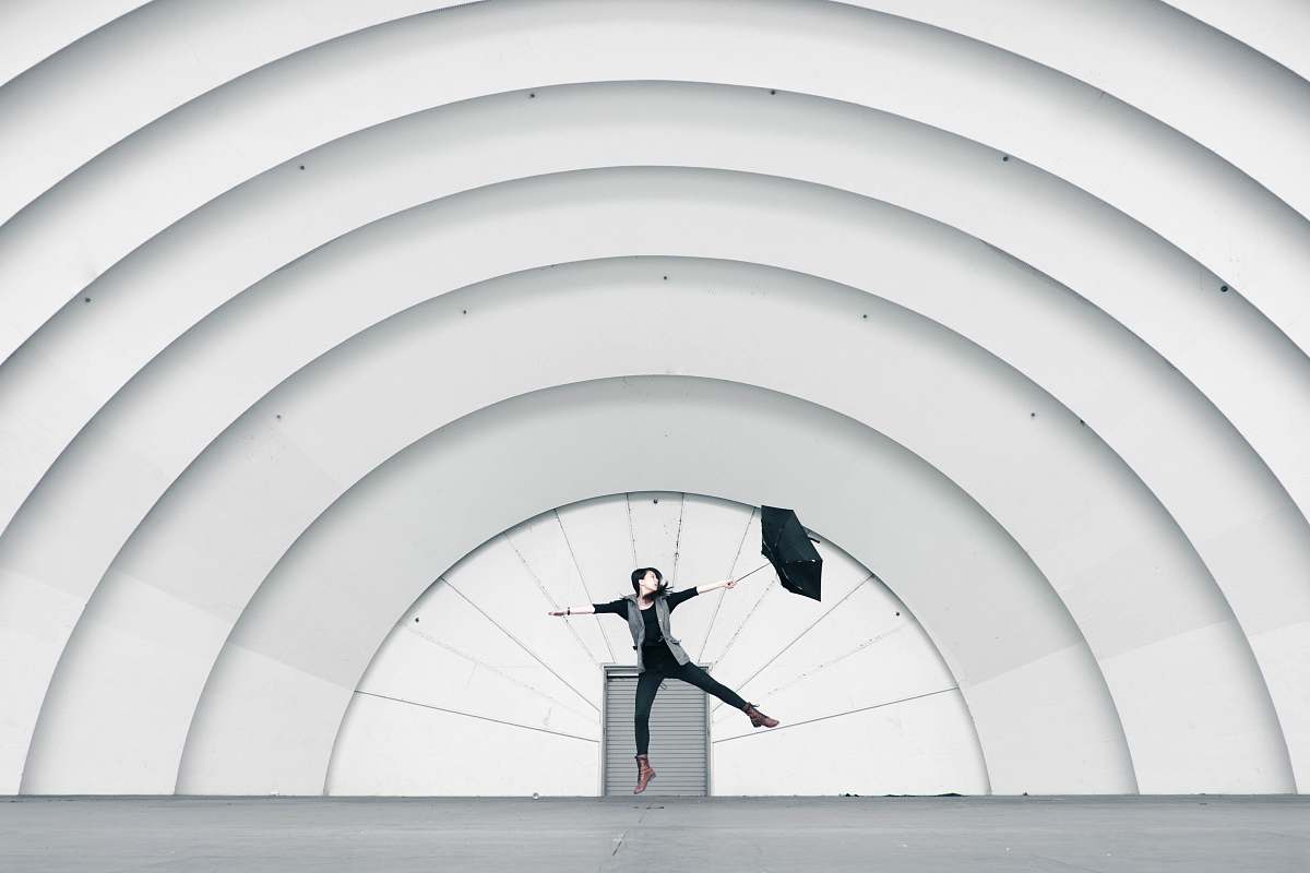 minimal woman standing on stage pattern