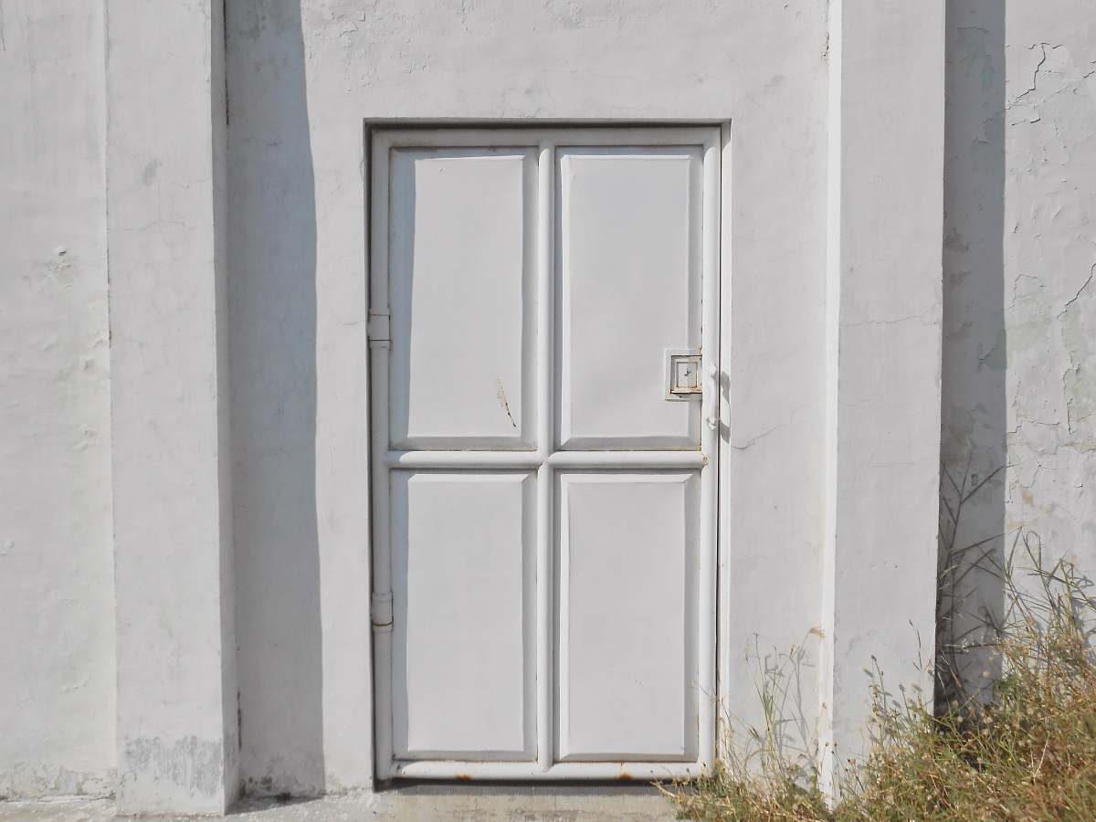 grey closed white door during daytime surabaya