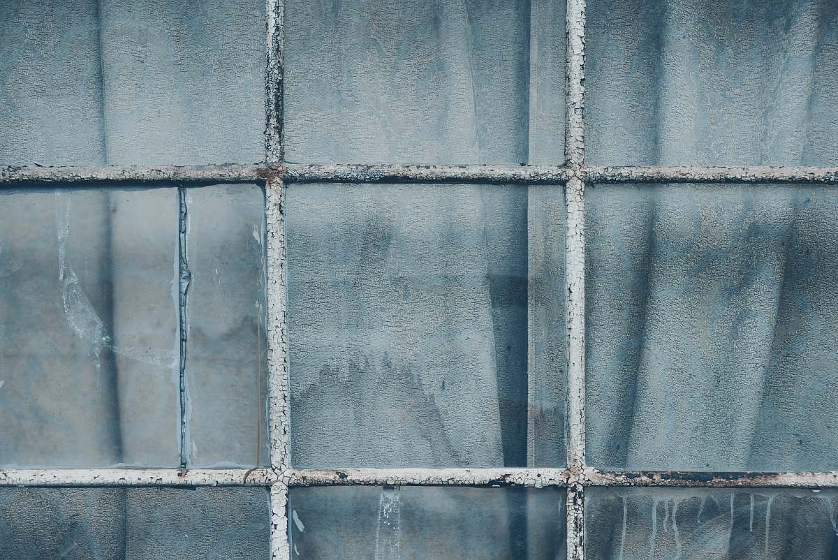 grey grey metal grill on clear glass window closeup photography window pane