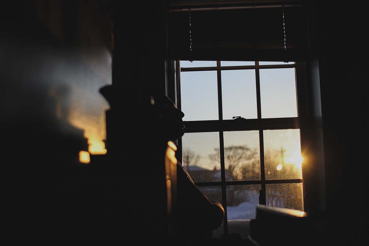 glass silhouette photography of window sun
