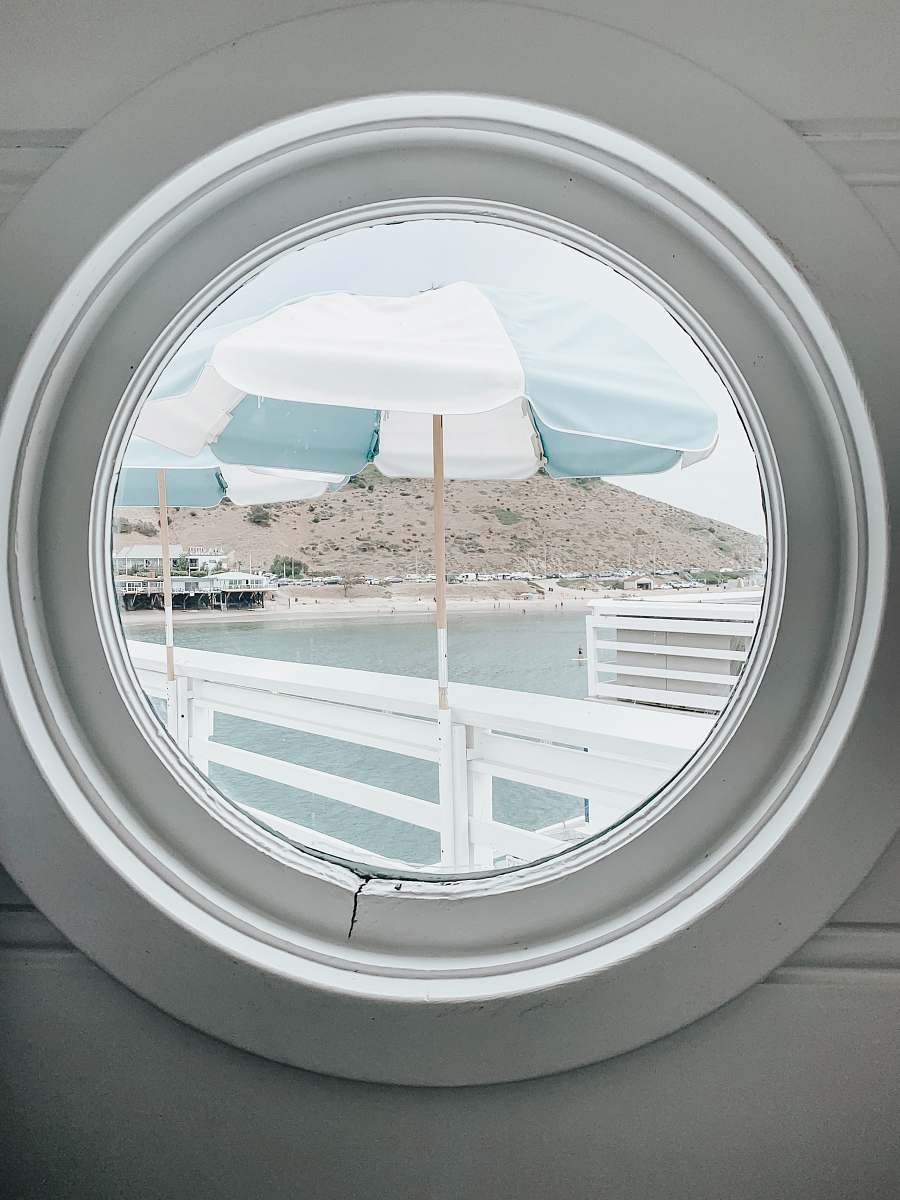 blue white and gray striped patio umbrella porthole