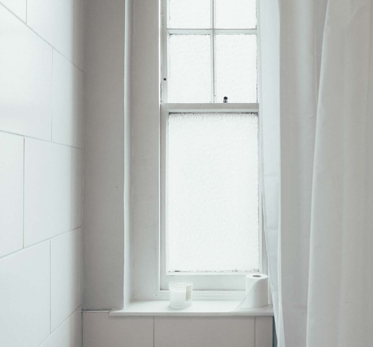furniture white toilet paper roll near the window white