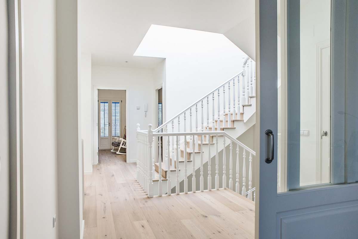 flooring white stairs near door hardwood