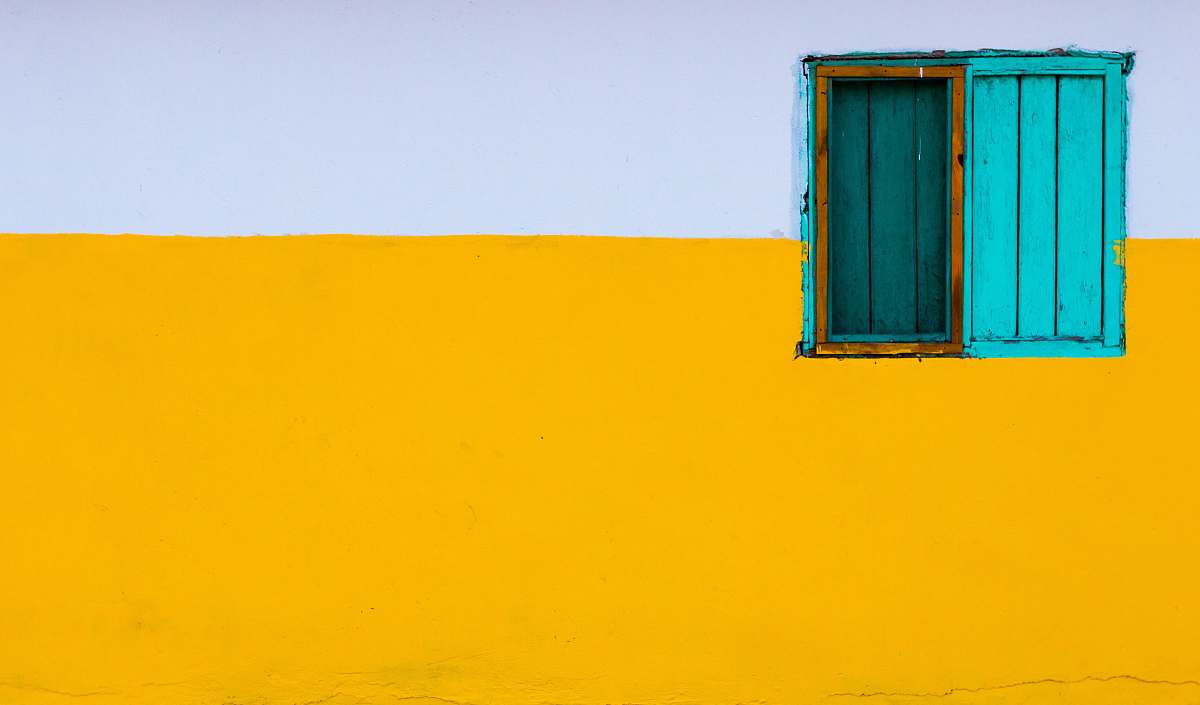 wall yellow and white painted wall with blue window texture