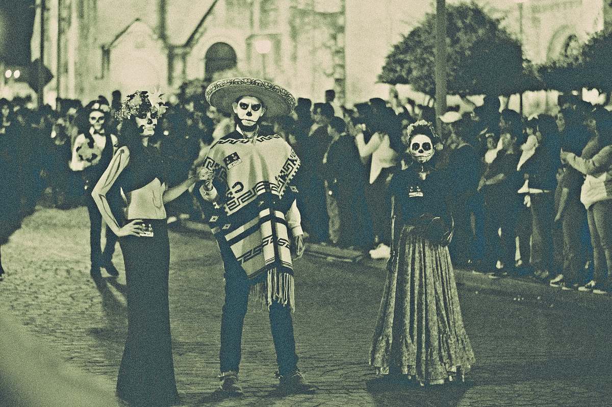 mexico three person standing on street dia de los muertos