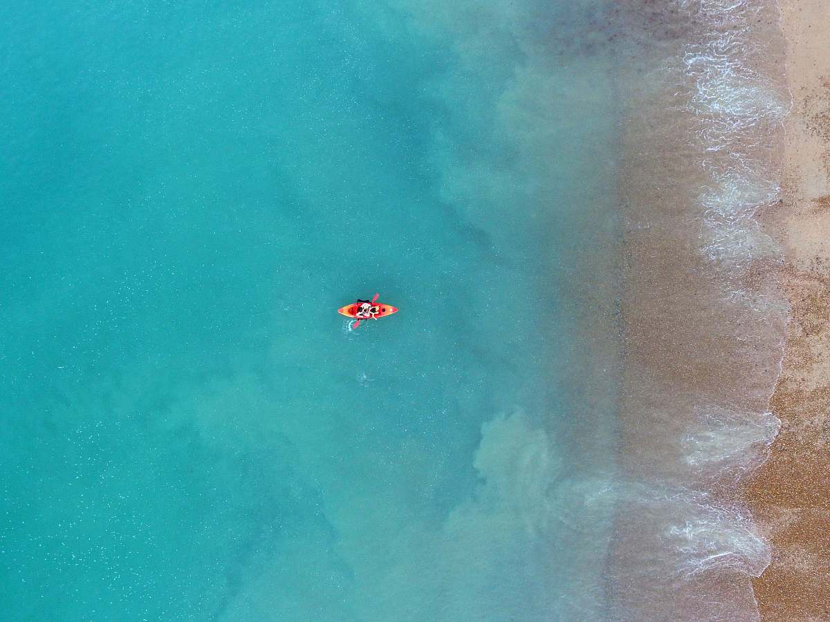 blue person kayaking on body of water brighton