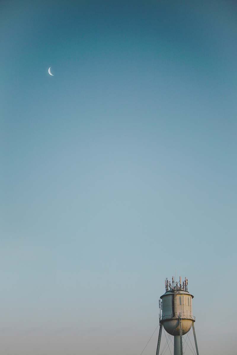 Discover a striking scene of a lone water tower set against the vastness of a desert landscape in Burlington, Vermont. This captivating image showcases the stark contrast between man-made structures and natural surroundings, making it ideal for use in travel blogs, environmental articles, and urban development presentations. Perfect for anyone seeking to illustrate themes of isolation, resilience, and the interplay between humanity and nature.