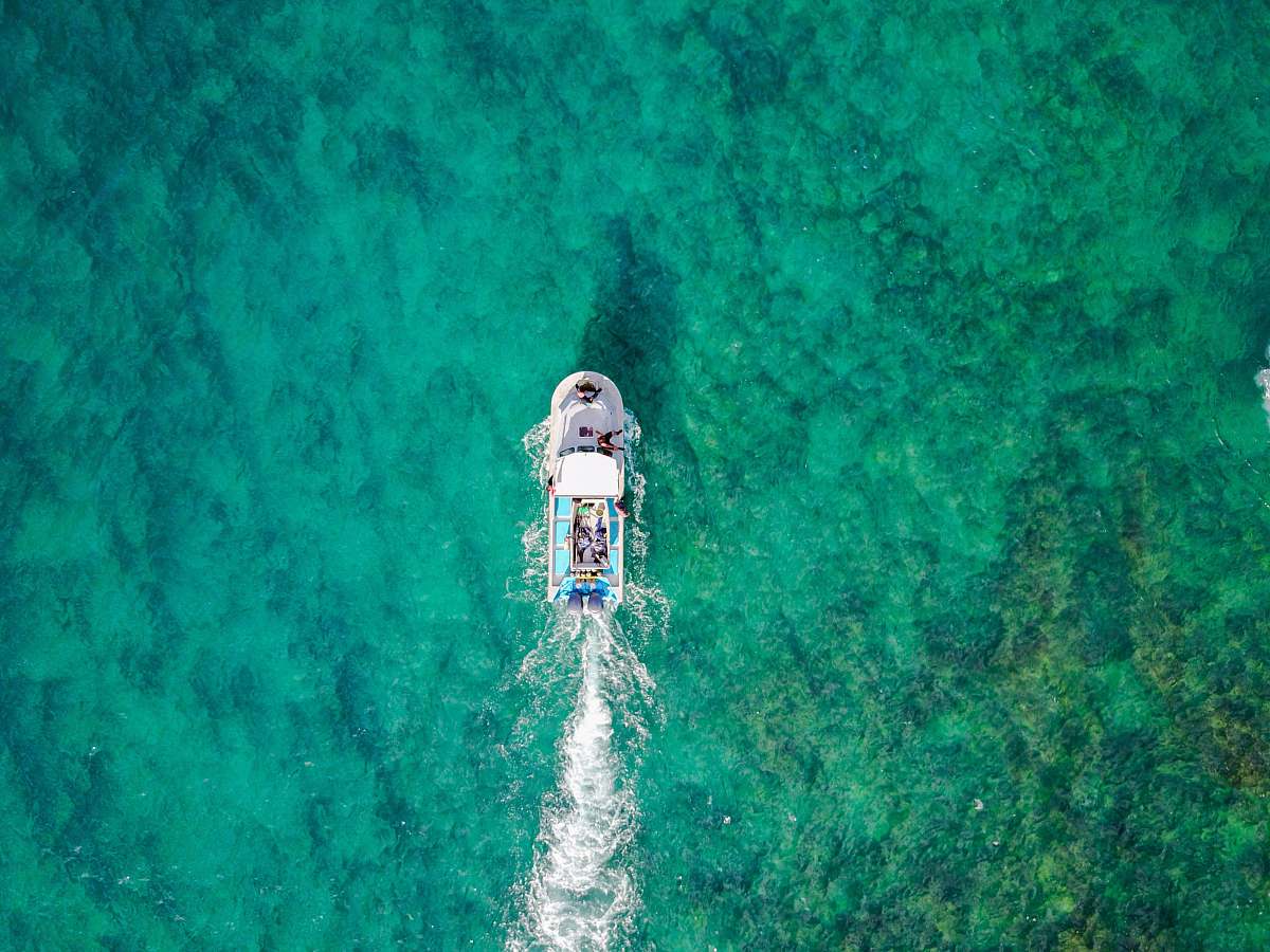 jesus aerial photo of white boat sailing on body of water at daytime united states