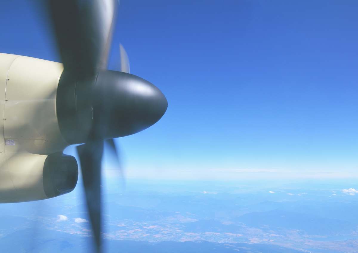 propeller aerial photography of black and white propeller plane