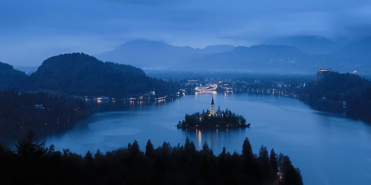 bled aerial photography of body of water surrounded by trees slovenia