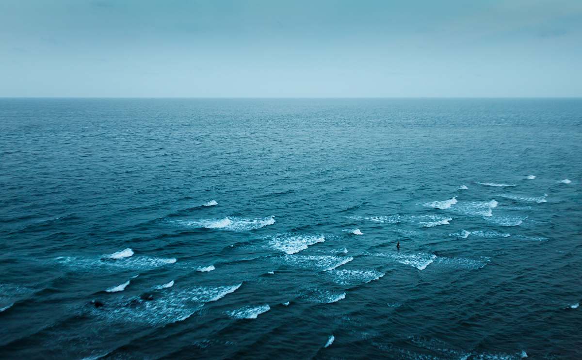 waves aerial photography of body of water ocean