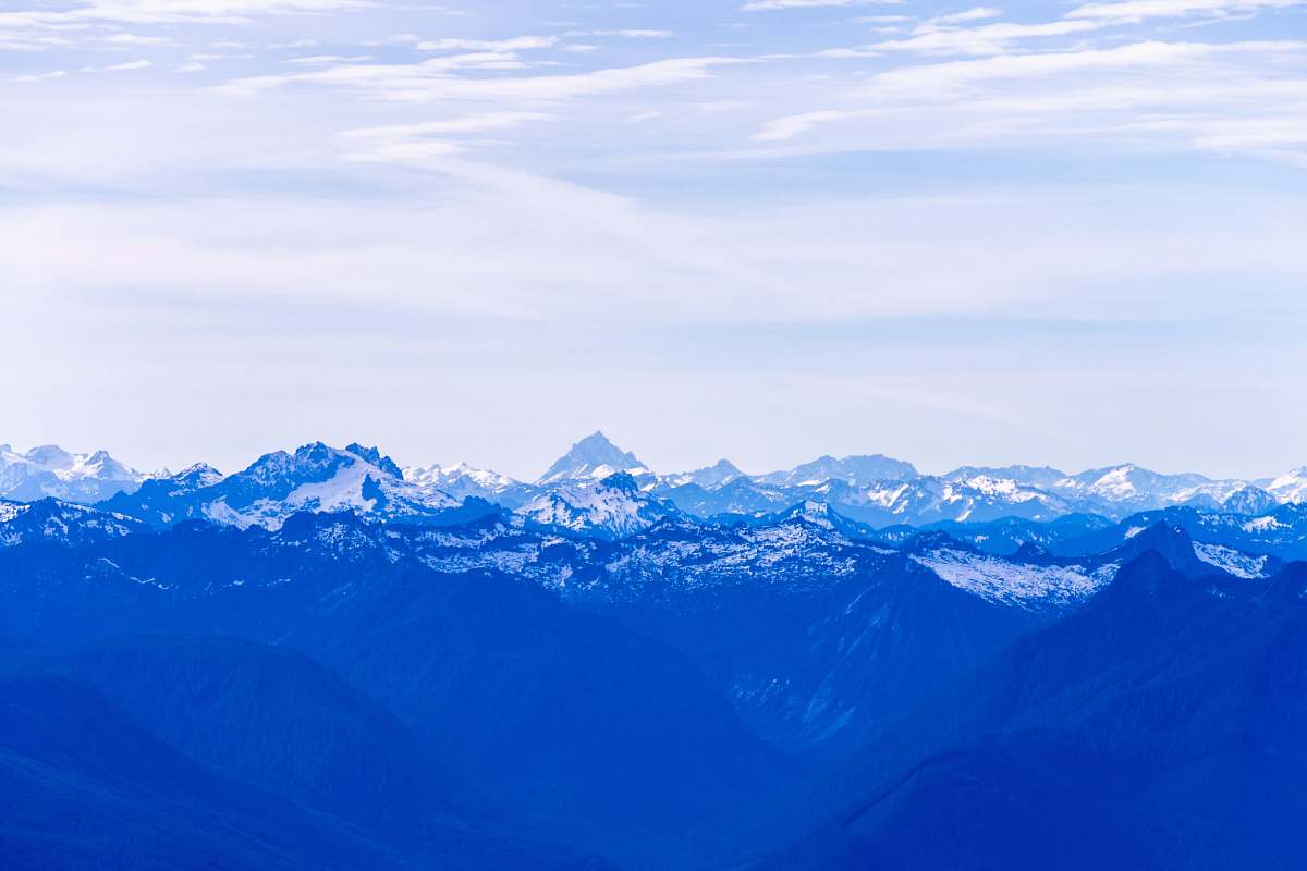 mountain aerial photography of white mountains during daytime snow
