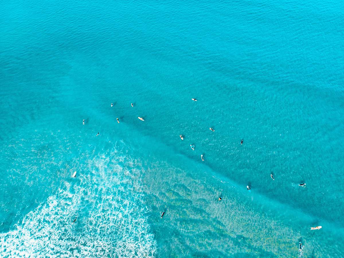 nature aerial view of surfers at the ocean landscape