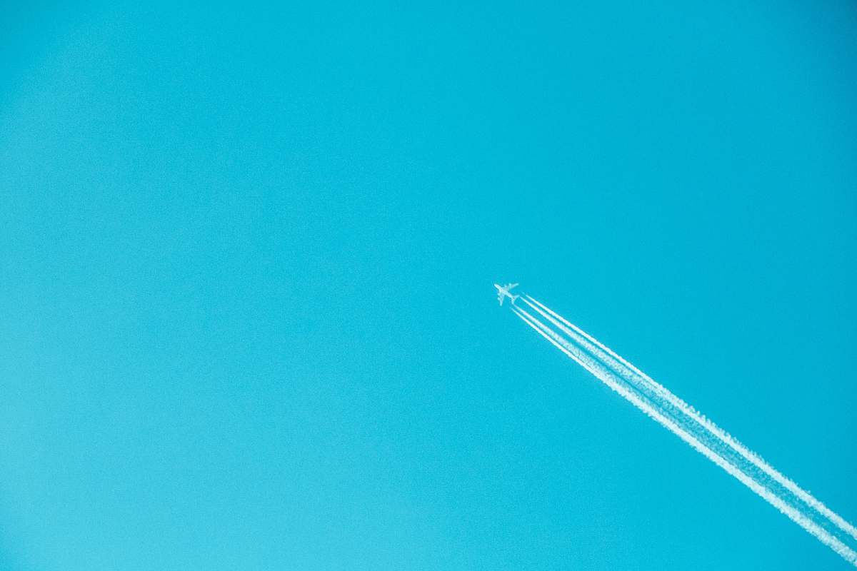 airplane airplane on mid air under clear sky teal