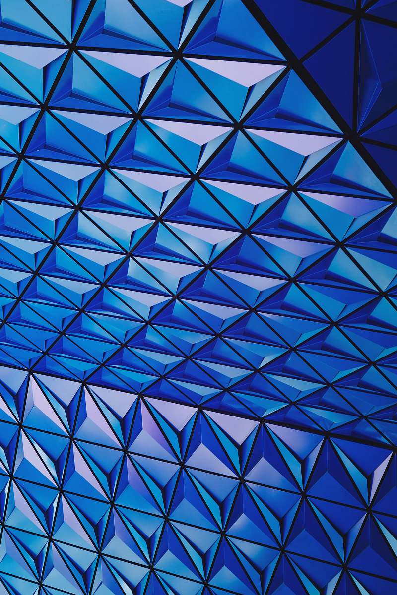pattern architectural photography of blue glass celing triangle