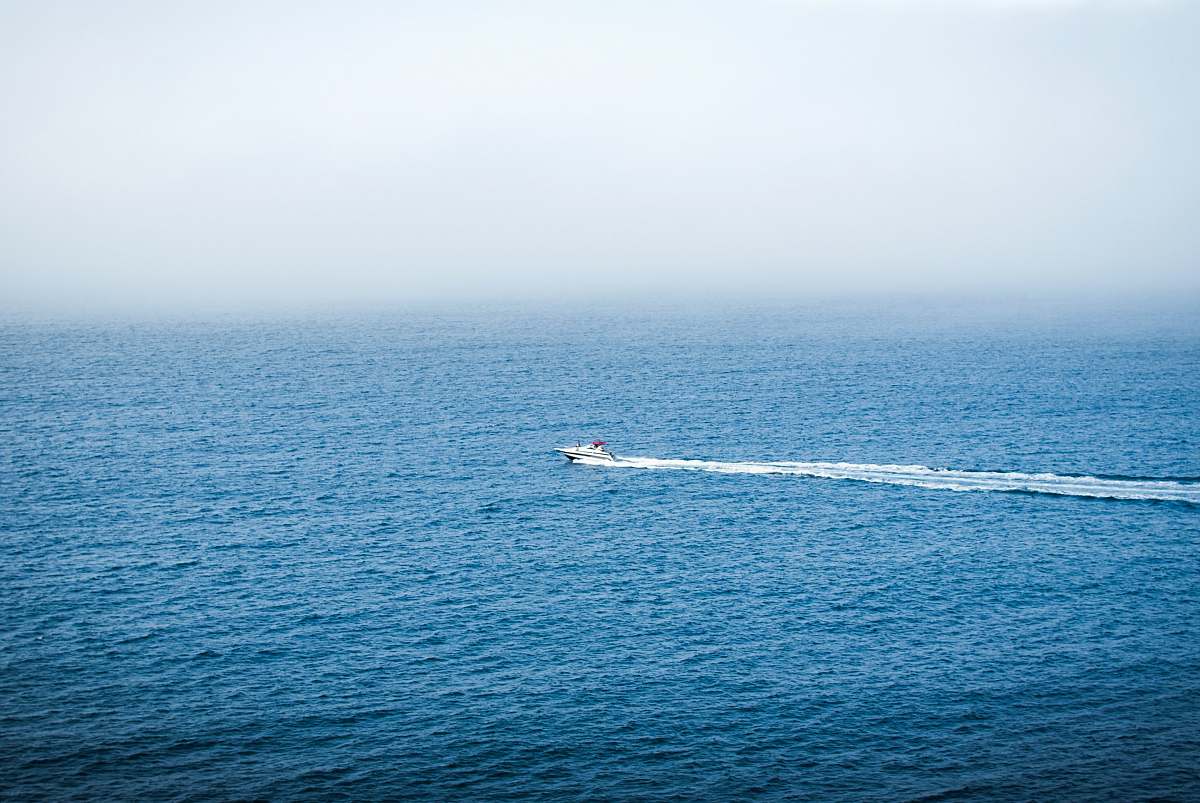 transportation birds eye photography of motorboat on body of water vehicle