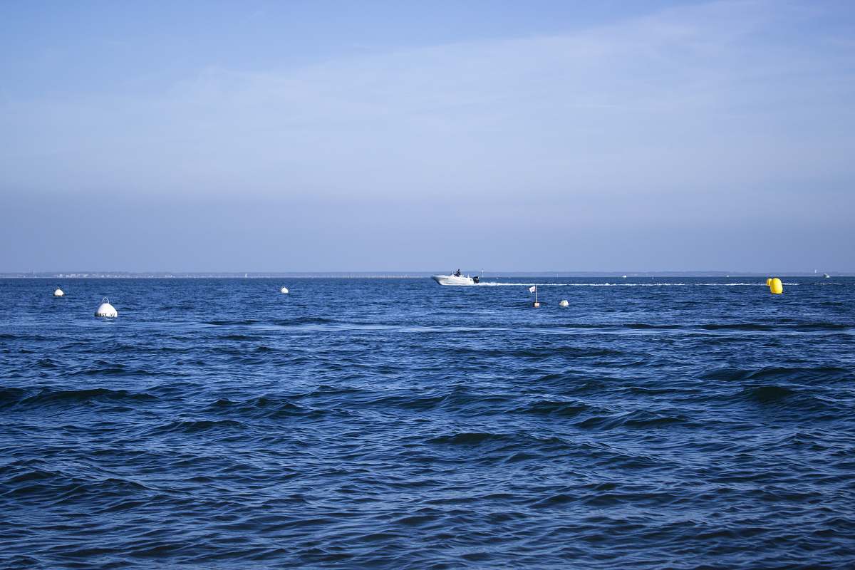 Experience the tranquility of nature with this stunning image featuring a boat gently gliding over the clear blue ocean. Perfect for travel blogs, nature magazines, or promotional materials for aquatic adventures, this photograph captures the essence of outdoor escapism. Ideal for evoking a sense of peace and freedom, it invites viewers to imagine their own journeys over serene waters.