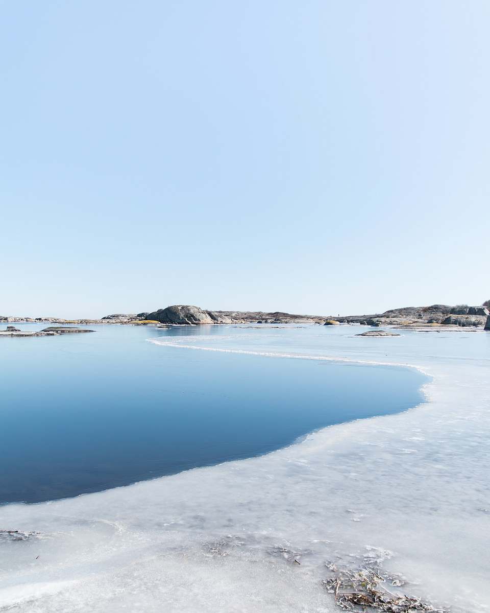 water body of water cover with snow near mountain lagoon
