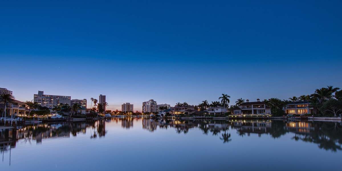 water body of water surrounded with buildings lake