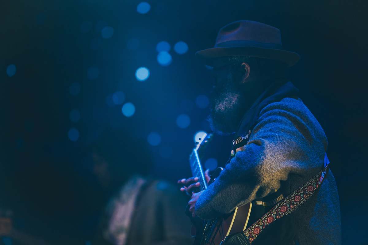 bokeh bokeh shot of man playing guitar music