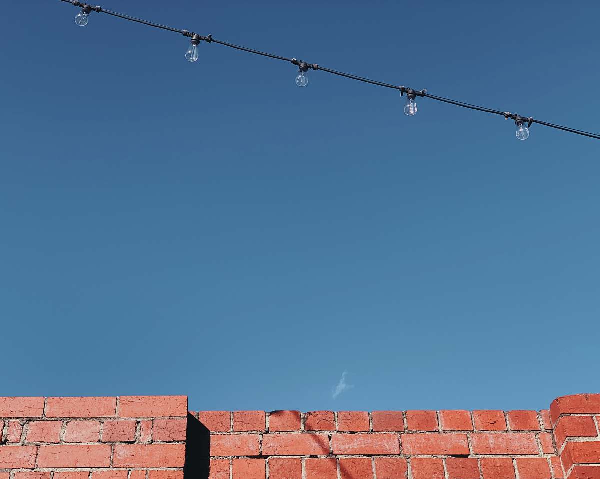 brick brown concrete wall utility pole