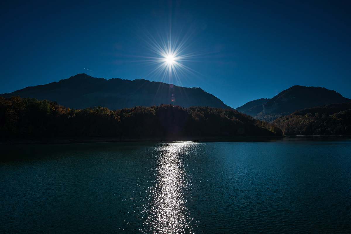 water brown mountain near body of water switzerland