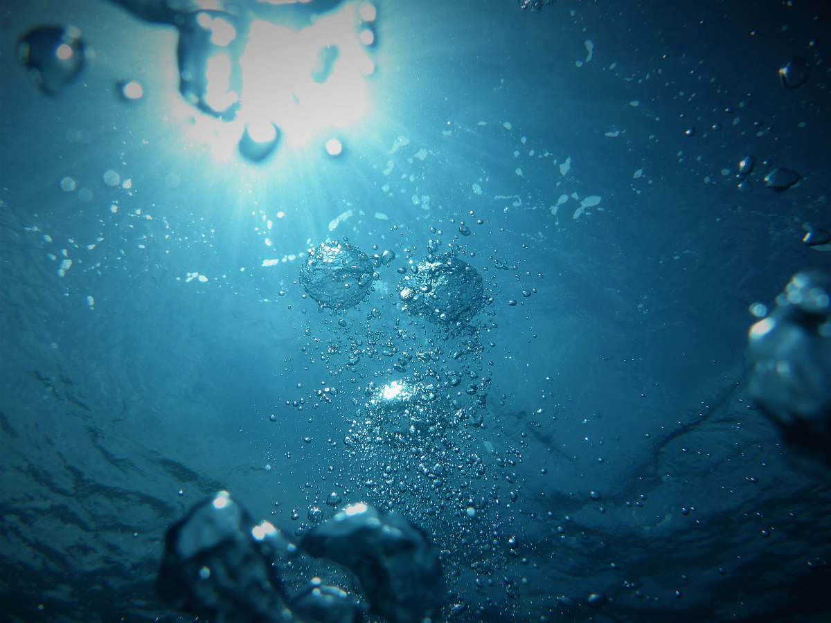 water bubbles going upwards on a body of water sea