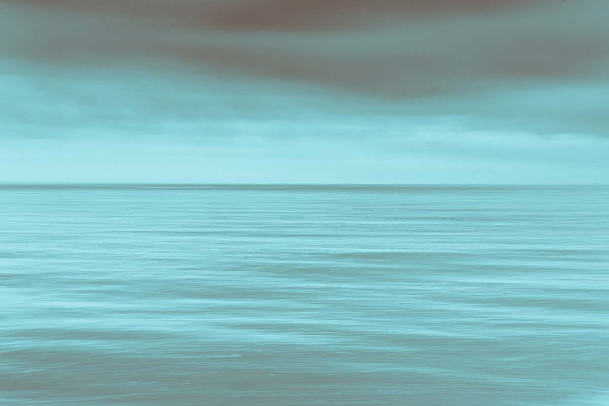 ocean calm sea under gray clouds sea
