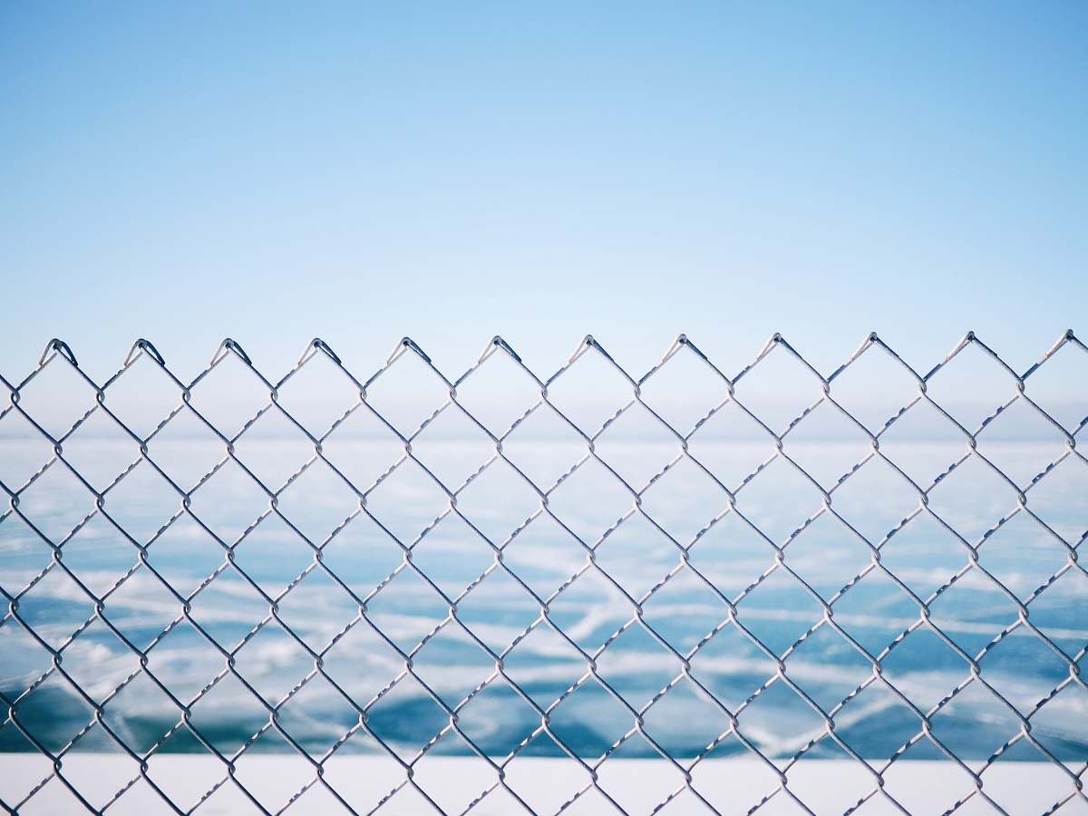 fence closeup photo of metal link fence chicago
