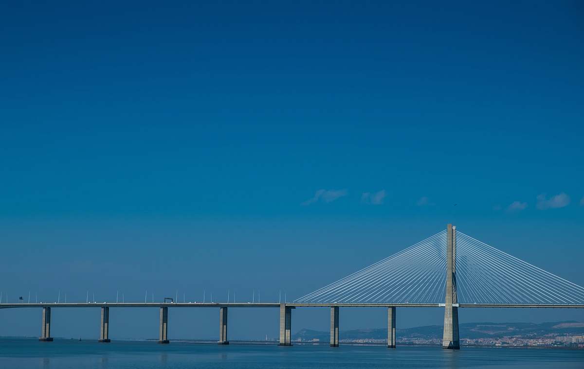 lisbon gray concrete bridge during daytime portugal