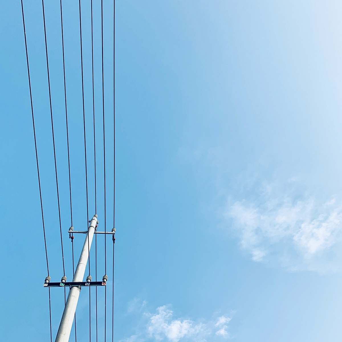 cable gray post with electrical wires during day power lines