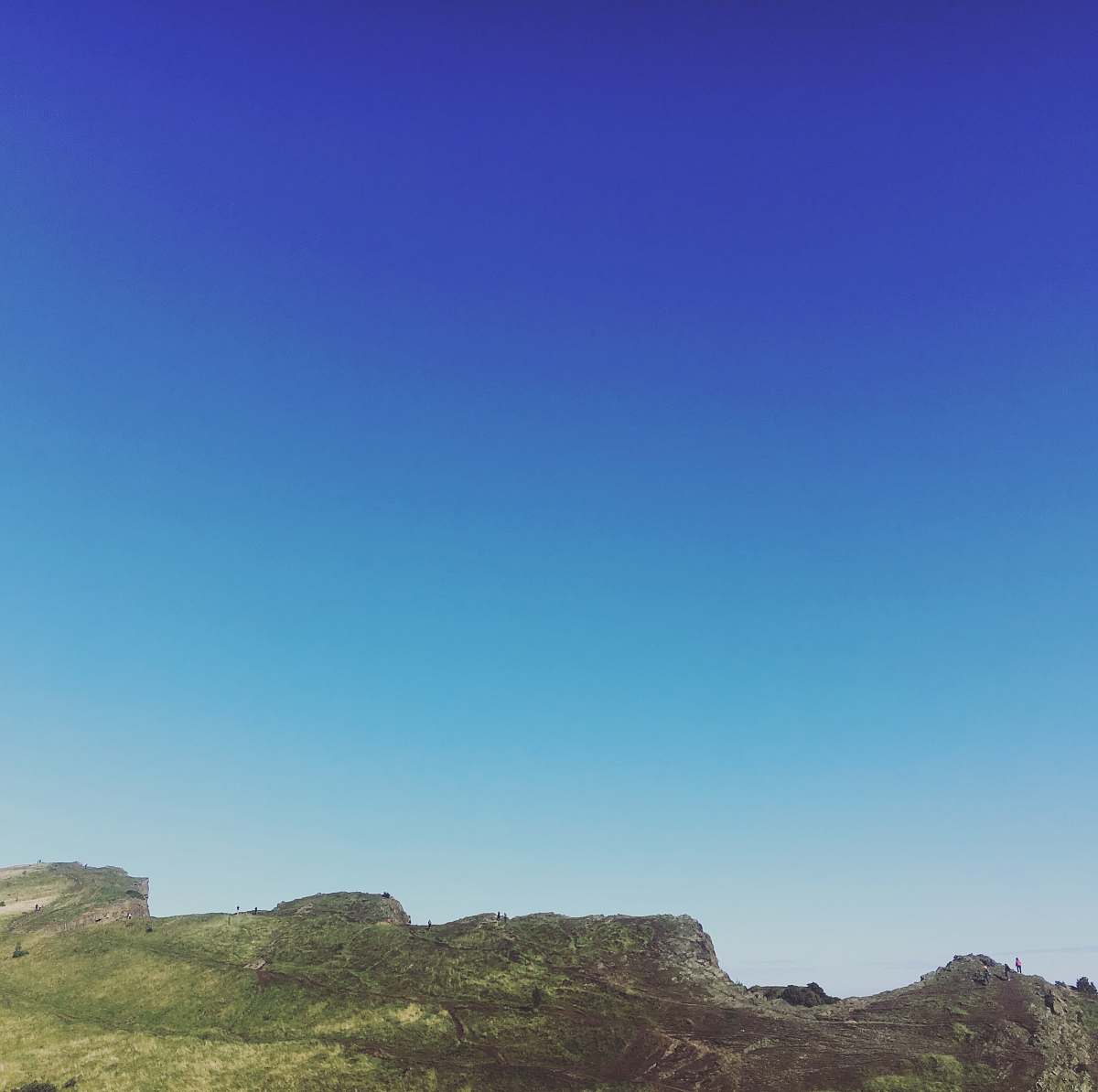 nature green and brown mountain under clear sky during daytime hill