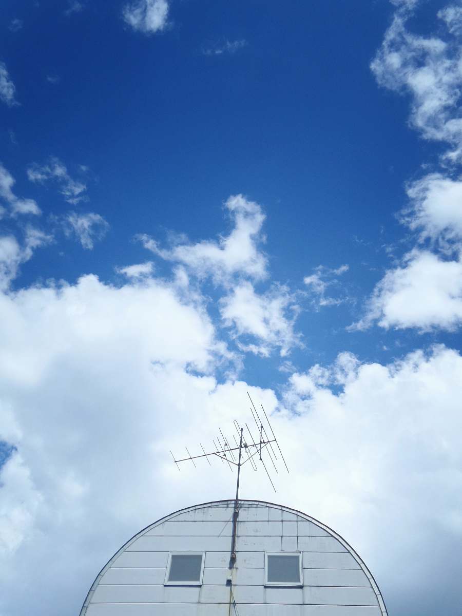 antenna grey antenna on top of white house electrical device