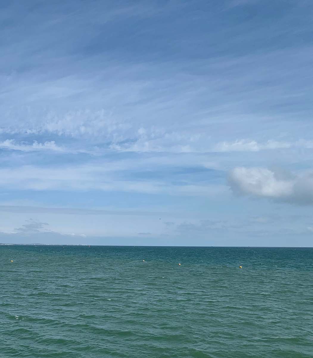 nature landscape photography of blue sea under a blue sky during daytime outdoors