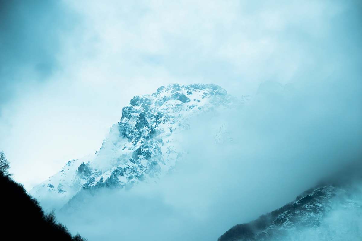 mountain landscape photography of snow-capped mountain covered with fog snow