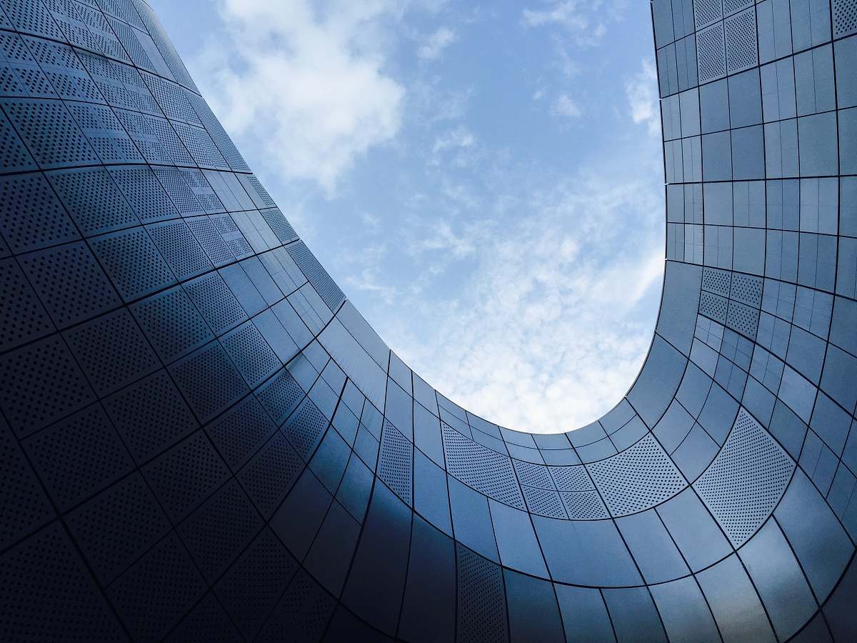 building low angle photo of glass building architecture