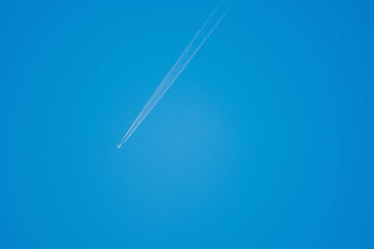 flare low-angle photography of plane light