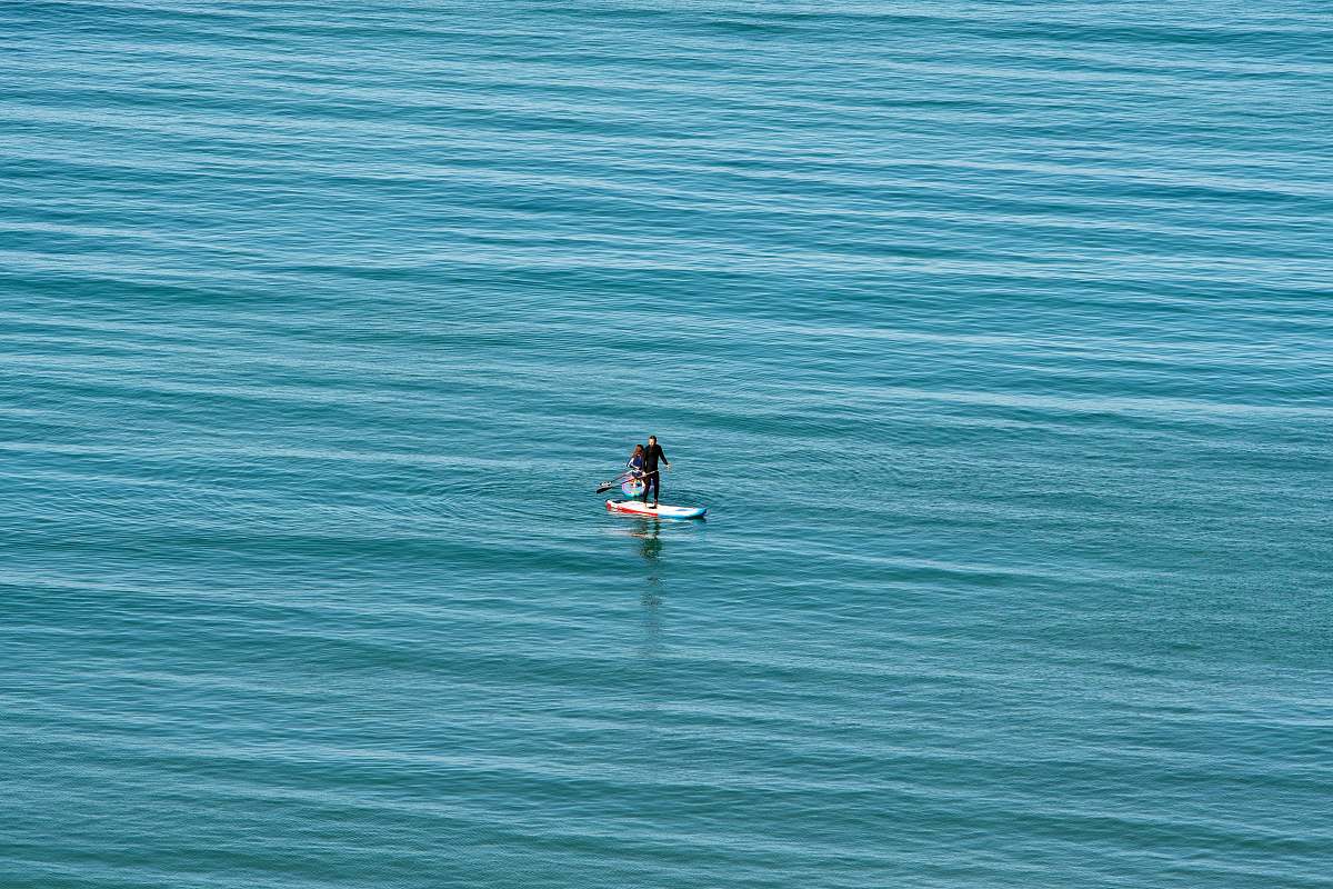 nature man on surfboard in water outdoors
