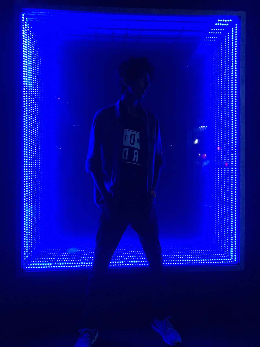 person man standing in front of light human