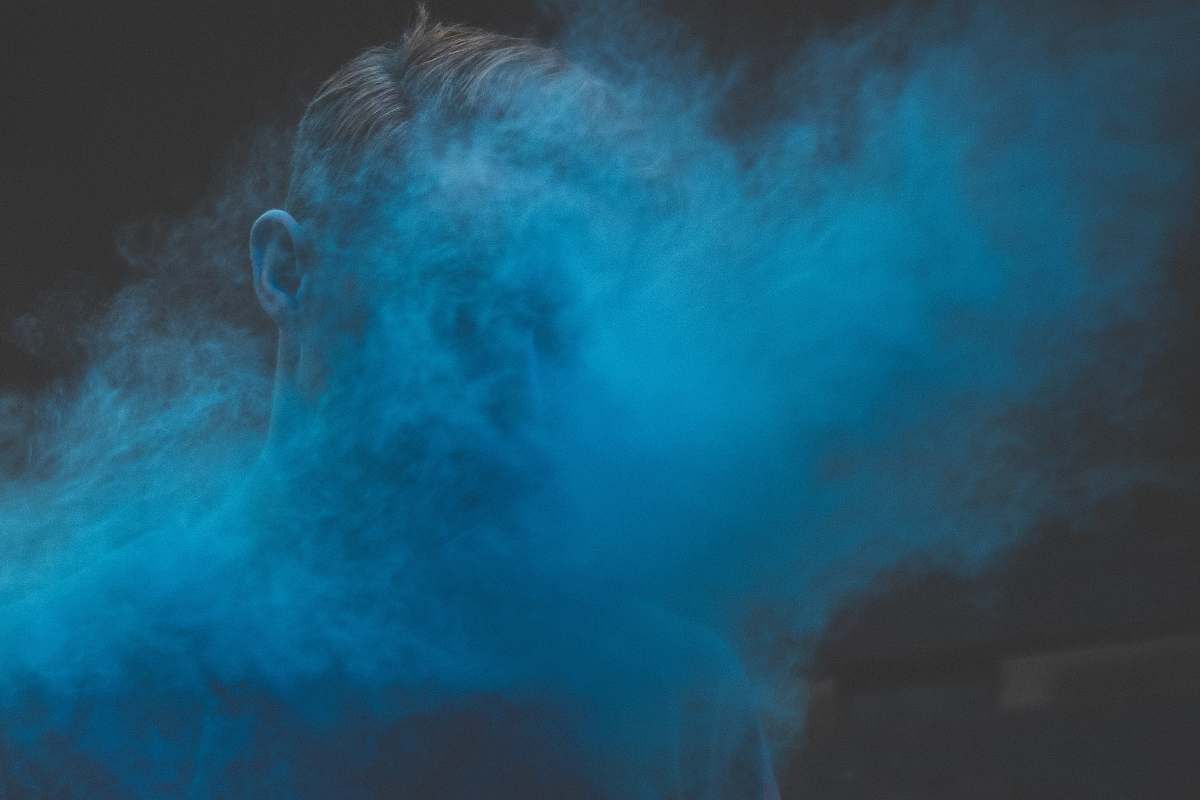 smoke man's face covered with smoke person